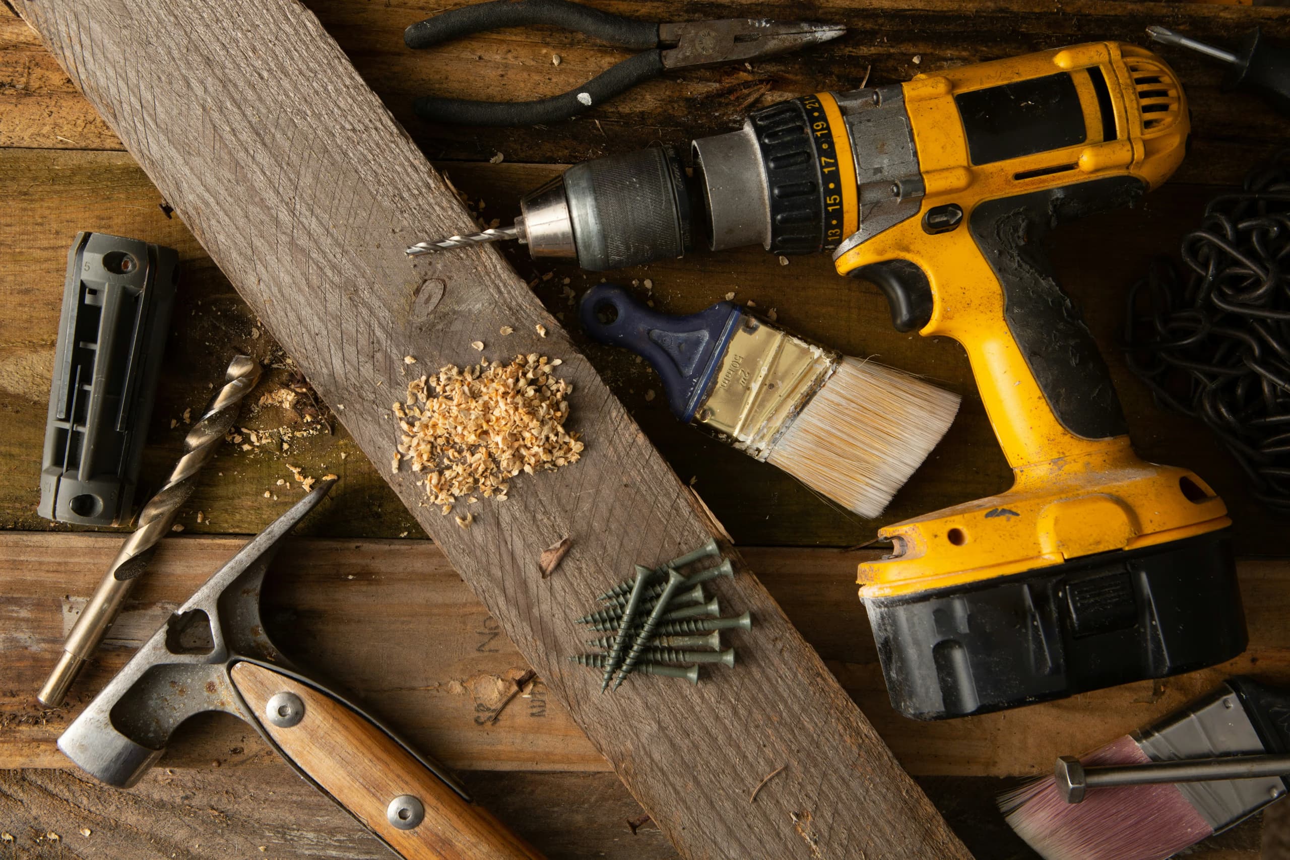 Professional handyman tools on a wooden workbench